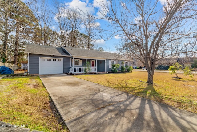 ranch-style house featuring a garage, covered porch, and a front lawn