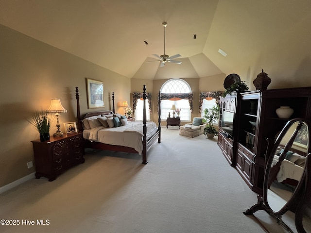 carpeted bedroom with ceiling fan and lofted ceiling