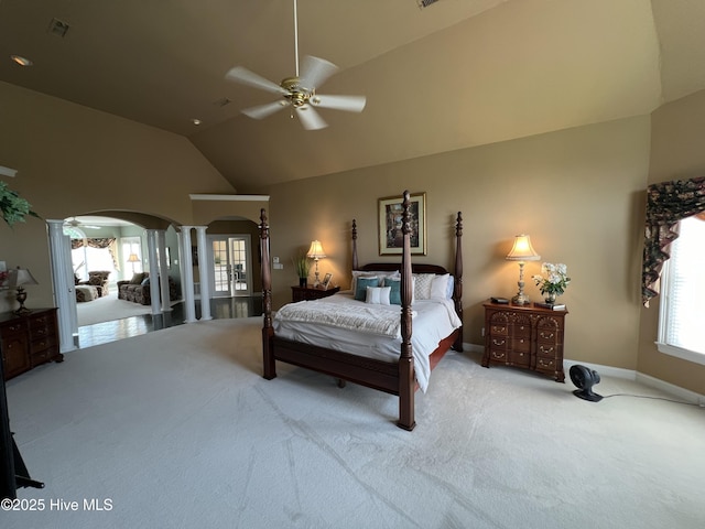 bedroom with ornate columns, lofted ceiling, light colored carpet, and ceiling fan