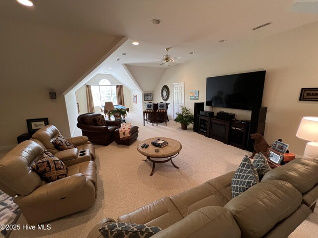 living room featuring lofted ceiling, light carpet, and ceiling fan