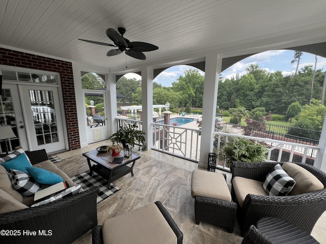 exterior space featuring ceiling fan and wood ceiling