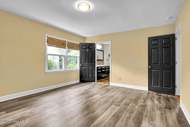 2817 Park Ave, Wilmington, NC 28403 - spare room featuring baseboards, wood finished floors, and a smoke detector