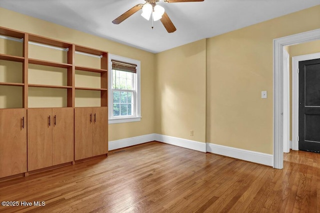 2817 Park Ave, Wilmington, NC 28403 - unfurnished bedroom featuring baseboards, light wood finished floors, and a ceiling fan