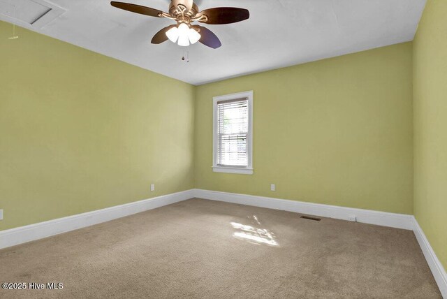 2817 Park Ave, Wilmington, NC 28403 - spare room with carpet, baseboards, a ceiling fan, and attic access