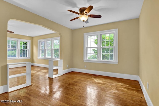 2817 Park Ave, Wilmington, NC 28403 - spare room with plenty of natural light, ceiling fan, and hardwood / wood-style floors