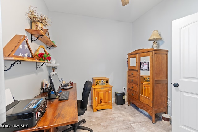 office with light wood-type flooring and baseboards