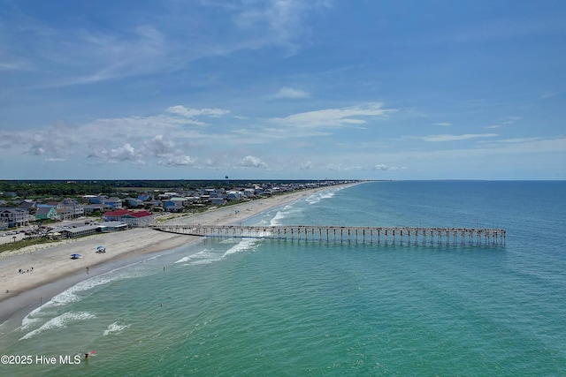 bird's eye view featuring a view of the beach and a water view