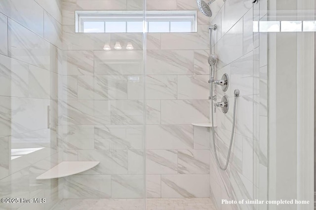 bathroom featuring a stall shower