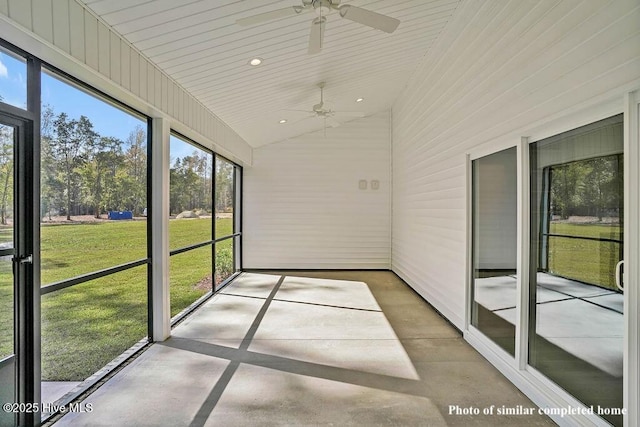 unfurnished sunroom with lofted ceiling