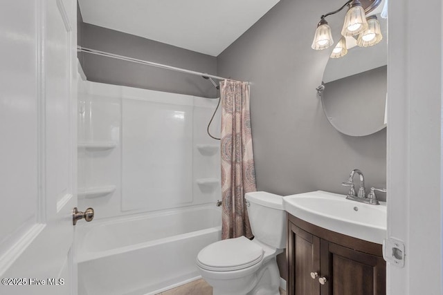 full bathroom with vanity, toilet, and shower / tub combo with curtain