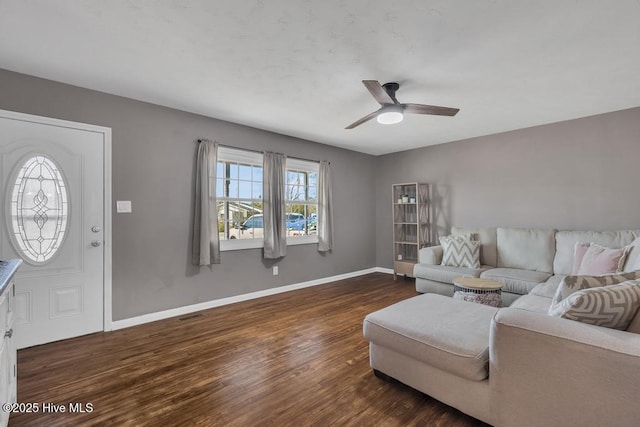 living room featuring ceiling fan and dark hardwood / wood-style floors