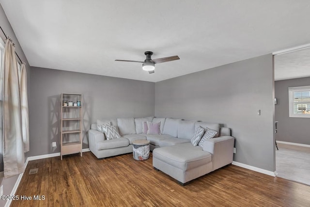 living room with ceiling fan and wood-type flooring