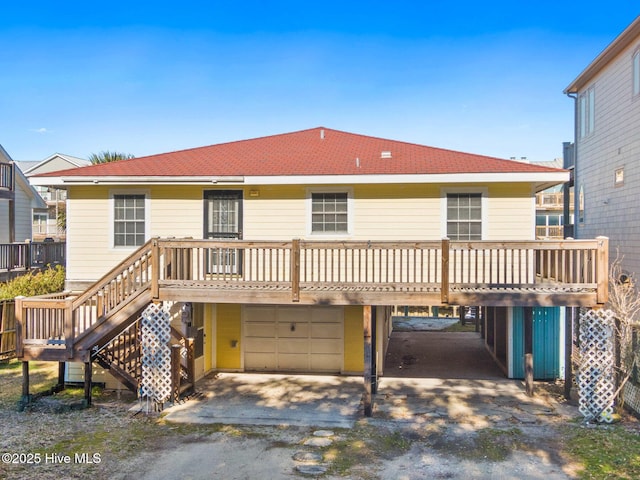 view of front of house with a garage and a wooden deck