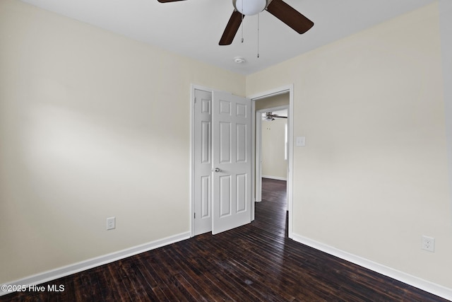 empty room featuring dark hardwood / wood-style flooring