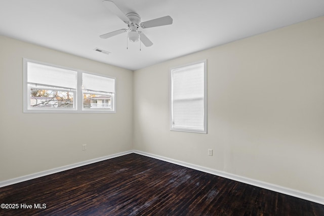 empty room with hardwood / wood-style flooring and ceiling fan