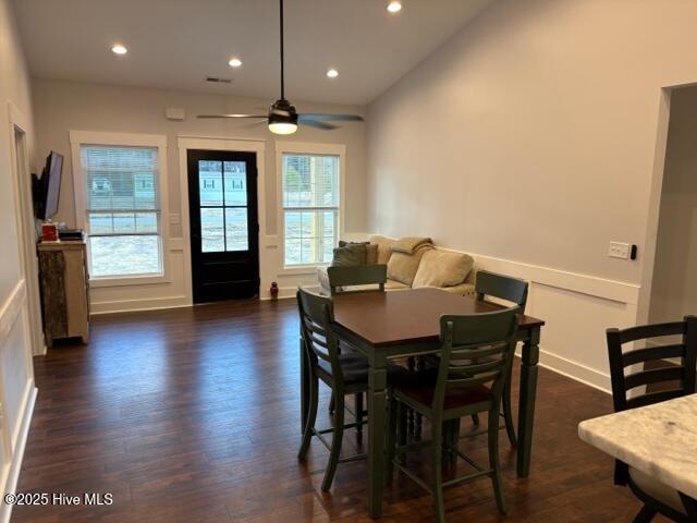 kitchen with appliances with stainless steel finishes, sink, lofted ceiling, and dark hardwood / wood-style flooring