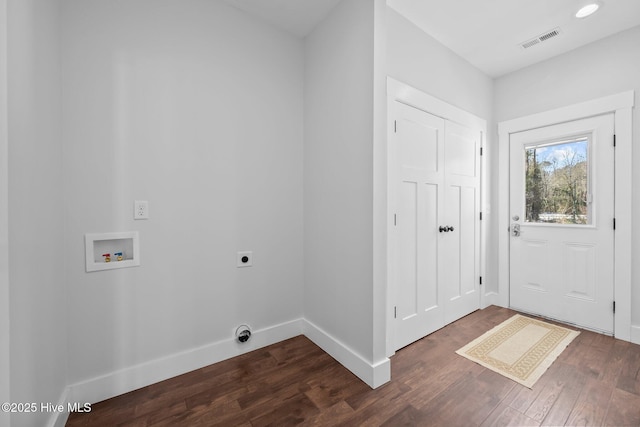 washroom with hookup for an electric dryer, dark hardwood / wood-style flooring, and hookup for a washing machine