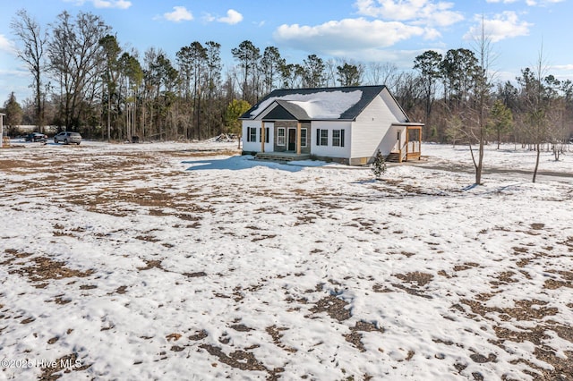 view of snow covered house