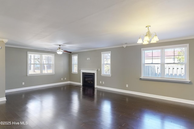 unfurnished living room featuring crown molding, a healthy amount of sunlight, and dark hardwood / wood-style flooring