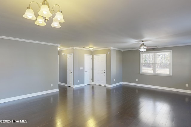 empty room featuring ceiling fan with notable chandelier, dark wood-type flooring, and ornamental molding