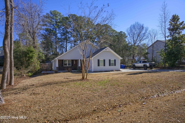 ranch-style house with a front lawn