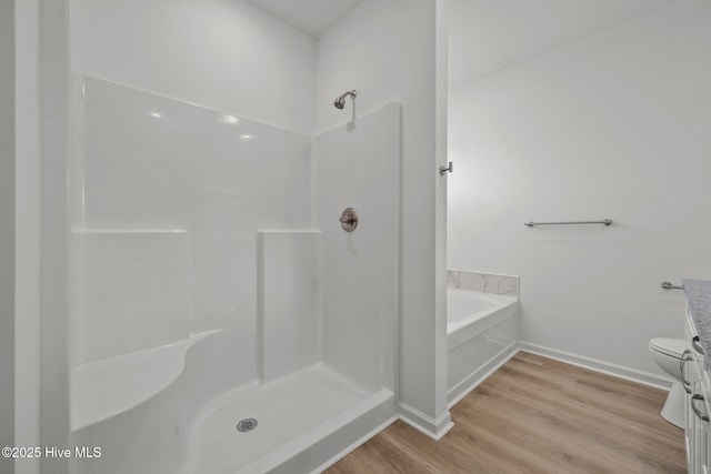 full bathroom with vanity, wood-type flooring, independent shower and bath, and toilet