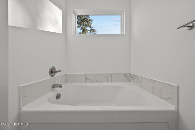 bathroom with a washtub