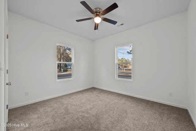 empty room featuring carpet and ceiling fan