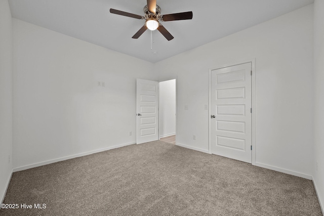 carpeted empty room with ceiling fan