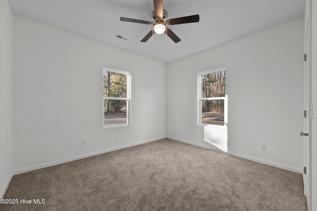 spare room with carpet flooring and ceiling fan