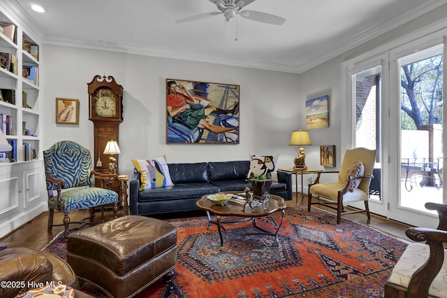 living room featuring crown molding and ceiling fan