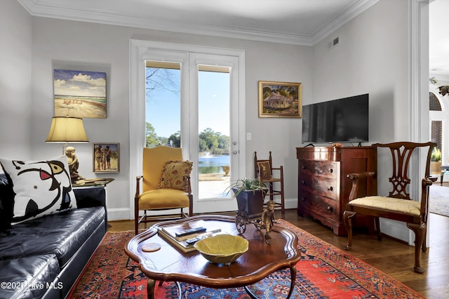 living room featuring hardwood / wood-style floors and ornamental molding