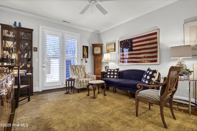 living room with crown molding and ceiling fan