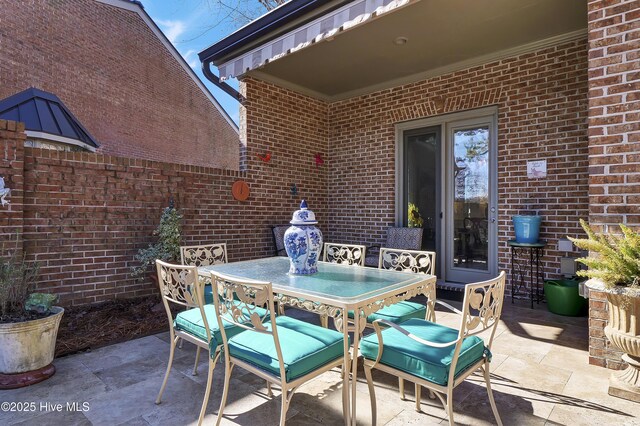 back of house featuring an outdoor living space and a patio