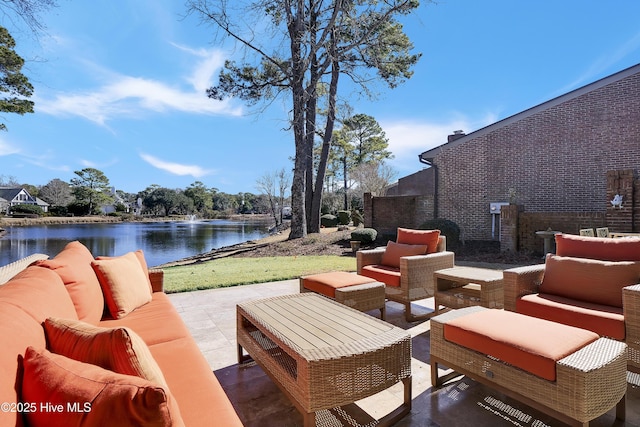 view of patio featuring a water view and an outdoor hangout area