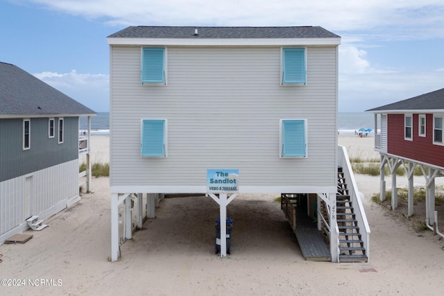 rear view of property featuring a water view