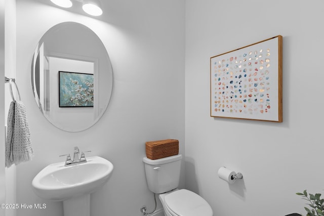 bathroom featuring sink and toilet