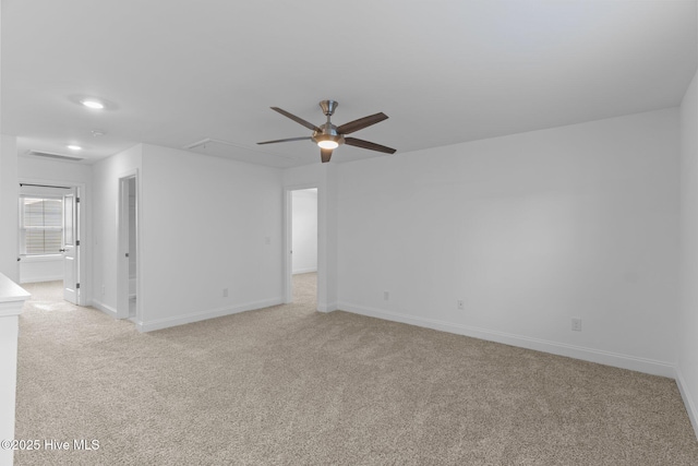 unfurnished room with light carpet and ceiling fan