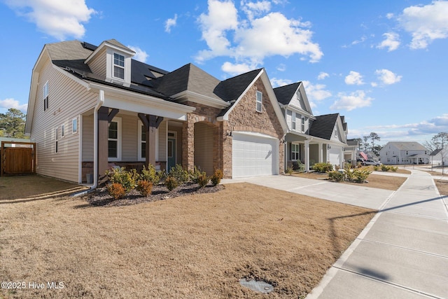 view of front of property featuring a garage and covered porch