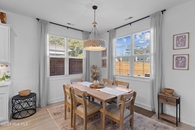 dining space featuring light hardwood / wood-style flooring