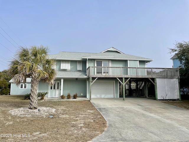 view of front of house featuring a garage and a carport