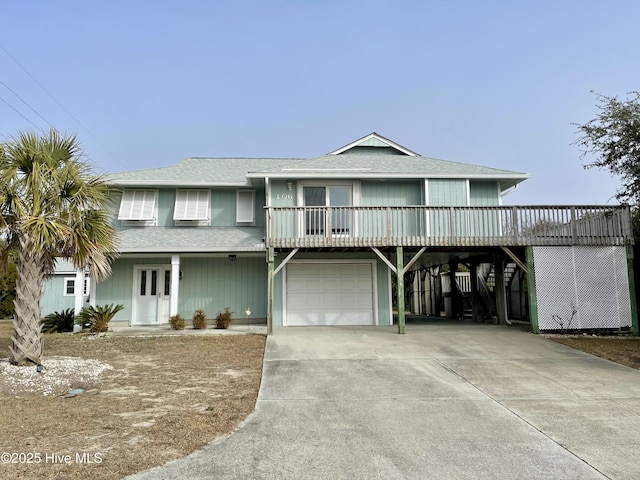 view of front of house with a carport and a garage