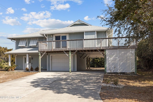 view of property featuring a garage and a carport