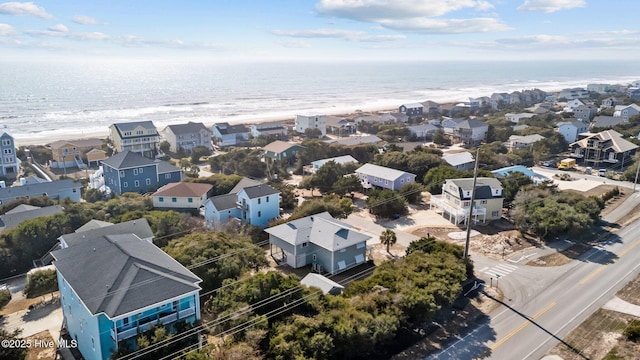 aerial view featuring a water view and a beach view