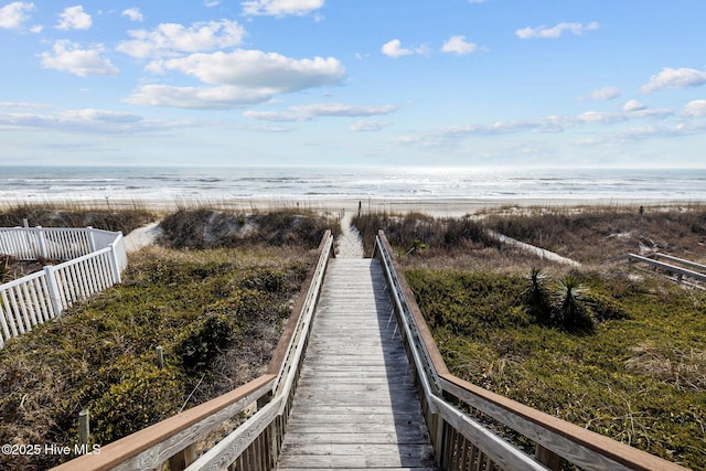 view of community featuring a water view and a view of the beach