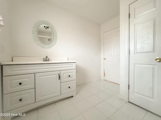 bathroom featuring tile patterned flooring and vanity