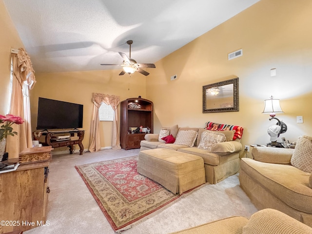 living room with lofted ceiling, light colored carpet, and ceiling fan