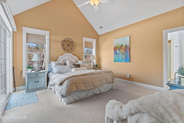 bedroom featuring multiple windows, light carpet, high vaulted ceiling, and ceiling fan