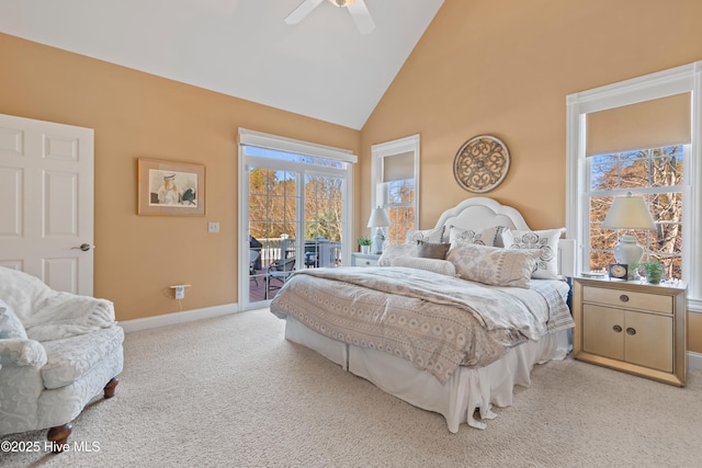 carpeted bedroom featuring multiple windows, ceiling fan, access to outside, and high vaulted ceiling