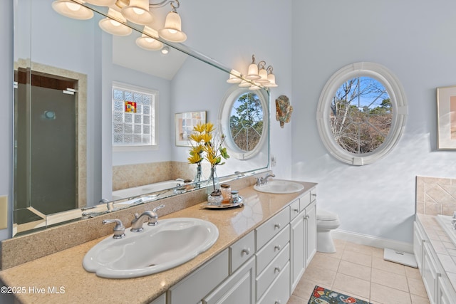 full bathroom with lofted ceiling, tile patterned floors, toilet, a chandelier, and vanity